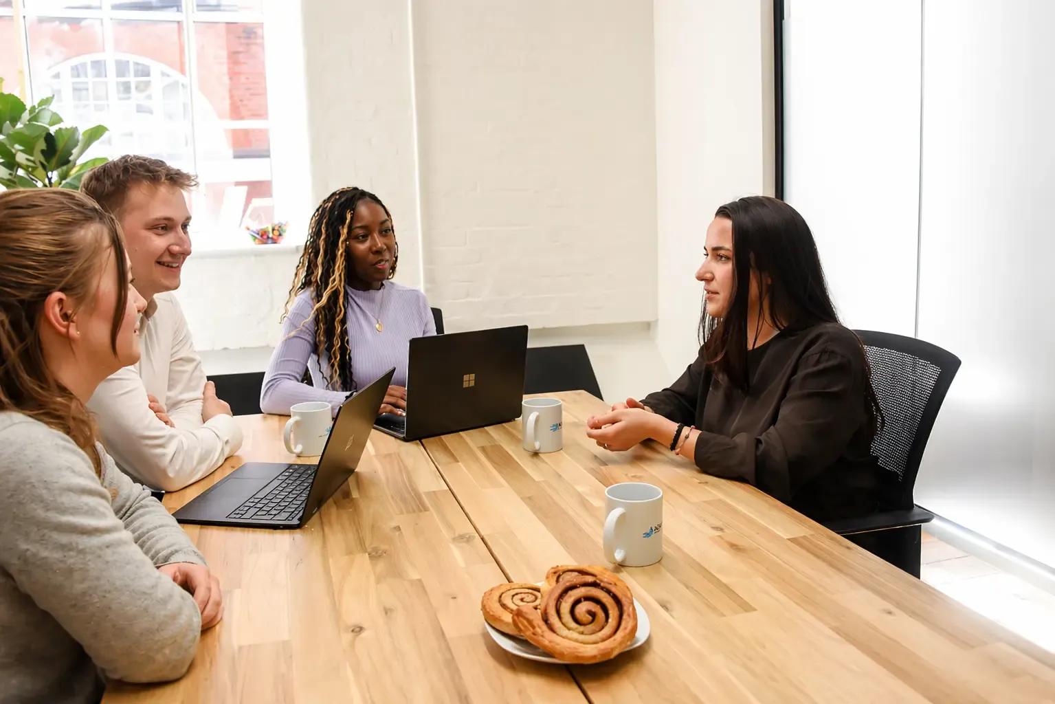 AI Consultants from ADSP collaborating on a new AI project in the London Office