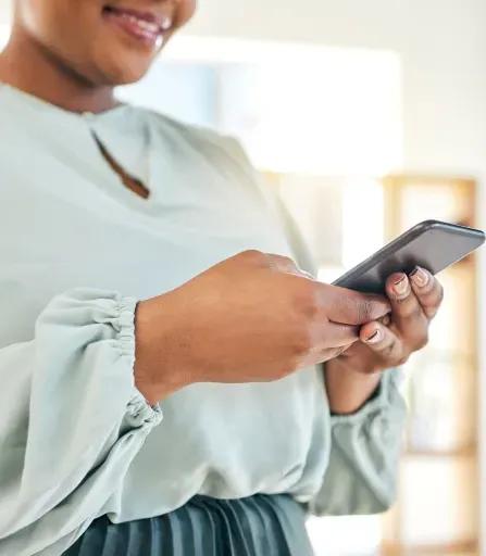 Person sending a text message illustrating text mining data collection